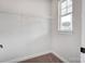 Walk-in closet with wire shelving and a window for natural light at 2003 Cedar Falls Dr # 69, Waxhaw, NC 28173