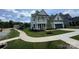 Beautiful two-story home with manicured lawn, covered porch, and an attached garage, showcasing curb appeal at 2003 Cedar Falls Dr # 69, Waxhaw, NC 28173