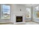 Elegant fireplace with marble surround and two large windows at 2003 Cedar Falls Dr # 69, Waxhaw, NC 28173