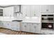 Modern kitchen features stainless steel appliances, white cabinets, a gas range, and stylish backsplash at 2003 Cedar Falls Dr # 69, Waxhaw, NC 28173