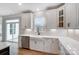 Bright kitchen showcases white cabinets, a farmhouse sink, stainless appliances, and easy access to the patio at 2003 Cedar Falls Dr # 69, Waxhaw, NC 28173