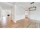 Spacious living room with hardwood floors, wainscoting, and a modern light fixture at 2003 Cedar Falls Dr # 69, Waxhaw, NC 28173