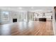 Open floorplan with fireplace, large windows, and kitchen with island at 2003 Cedar Falls Dr # 69, Waxhaw, NC 28173