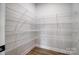 Walk-in pantry with metal shelving to keep you organized and create space in the rest of your kitchen at 2003 Cedar Falls Dr # 69, Waxhaw, NC 28173