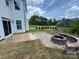 Outdoor patio featuring a custom stone fire pit and seating area, perfect for entertaining and relaxation at 2003 Cedar Falls Dr # 69, Waxhaw, NC 28173