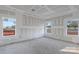 Unfinished bedroom with multiple windows and high ceilings at 6100 Lowder Rd, Salisbury, NC 28147