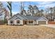 Newly built home with gray siding, landscaping, and a two-car garage at 6100 Lowder Rd, Salisbury, NC 28147