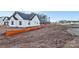 Side view of new construction home, showing unfinished yard at 6100 Lowder Rd, Salisbury, NC 28147