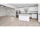 Open concept kitchen with island, stainless steel appliances, and light flooring at 6100 Lowder Rd, Salisbury, NC 28147