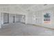 Unfinished living area with vaulted ceilings and multiple windows at 6100 Lowder Rd, Salisbury, NC 28147