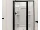 Bathroom with a new white shower enclosure, black hardware, and built-in shelving at 6122 Lowder Rd, Salisbury, NC 28147