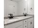 Bathroom showcasing dual granite vanity, sleek black fixtures, and a large mirror at 6122 Lowder Rd, Salisbury, NC 28147