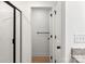 Bathroom featuring a shower with black trim, granite counters, and wood look flooring at 6122 Lowder Rd, Salisbury, NC 28147