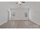 Primary bedroom featuring neutral paint colors, luxury vinyl flooring, and two windows for natural light at 6122 Lowder Rd, Salisbury, NC 28147