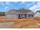 New construction home featuring a two-car garage, craftsman style architecture, and professional landscaping at 6122 Lowder Rd, Salisbury, NC 28147