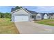 Charming single-story home with a two-car garage and a well-manicured lawn for curb appeal at 6122 Lowder Rd, Salisbury, NC 28147