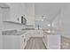 Elegant kitchen with stainless steel appliances, granite countertops, white cabinetry, and luxury vinyl flooring at 6122 Lowder Rd, Salisbury, NC 28147