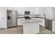 A modern kitchen is equipped with stainless steel appliances, white cabinets, and a granite countertop island at 6122 Lowder Rd, Salisbury, NC 28147