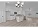 Modern kitchen with granite countertops, stainless steel appliances, an island, and white cabinets at 6122 Lowder Rd, Salisbury, NC 28147