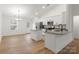 Modern kitchen with stainless steel appliances, granite countertops, white cabinets, and an adjacent dining area at 6122 Lowder Rd, Salisbury, NC 28147