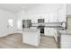 Modern kitchen with stainless steel appliances, white cabinets, hardwood floors, granite countertops and a kitchen island at 6122 Lowder Rd, Salisbury, NC 28147