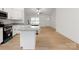 Modern kitchen with island, granite countertops, and stainless steel appliances at 6122 Lowder Rd, Salisbury, NC 28147