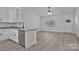 Bright kitchen with granite countertops, stainless steel appliances, and a view of the spacious living area at 6122 Lowder Rd, Salisbury, NC 28147