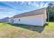 Back exterior of the home featuring siding and a well-maintained lawn at 6154 Lowder Rd, Salisbury, NC 28147