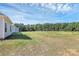 Spacious backyard with an expansive green lawn, offering plenty of room for recreation and enjoying the outdoors at 6154 Lowder Rd, Salisbury, NC 28147