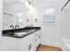 Bathroom featuring a double sink vanity with black hardware and mirror at 6154 Lowder Rd, Salisbury, NC 28147