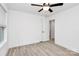 Spacious bedroom with ceiling fan and door to bathroom at 6154 Lowder Rd, Salisbury, NC 28147