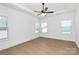 Spacious bedroom with lots of light from the three windows and tray ceiling at 6154 Lowder Rd, Salisbury, NC 28147