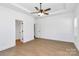 Bright bedroom with a ceiling fan and wood-look floors at 6154 Lowder Rd, Salisbury, NC 28147