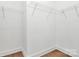 White walk-in closet featuring shelving for storage at 6154 Lowder Rd, Salisbury, NC 28147