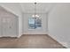 Bright dining area with hardwood floors and a modern chandelier for cozy meals at 6154 Lowder Rd, Salisbury, NC 28147