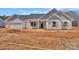 Charming home with white siding, gray shutters, and a covered front porch at 6154 Lowder Rd, Salisbury, NC 28147