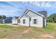 Charming home featuring blue and white exterior, complemented by a well-manicured lawn and inviting curb appeal at 6154 Lowder Rd, Salisbury, NC 28147