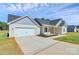 Attractive single-story home featuring an attached garage and well-maintained landscaping, perfect for curb appeal at 6154 Lowder Rd, Salisbury, NC 28147