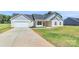 Inviting home with a two-car garage, a walkway to the front door, and a well-maintained lawn at 6154 Lowder Rd, Salisbury, NC 28147