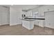 Modern kitchen with white cabinets, an island, and stainless steel appliances at 6154 Lowder Rd, Salisbury, NC 28147