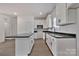 Modern kitchen features white cabinets, black countertops and stainless steel appliances at 6154 Lowder Rd, Salisbury, NC 28147
