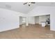 Open-concept living room with vaulted ceilings, modern flooring, and seamless flow to the kitchen at 6154 Lowder Rd, Salisbury, NC 28147