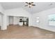 Bright living area featuring a ceiling fan, light-colored walls, and access to the kitchen at 6154 Lowder Rd, Salisbury, NC 28147