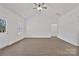 Bright living space with ceiling fan, neutral walls, and light, modern flooring at 6154 Lowder Rd, Salisbury, NC 28147