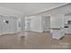 Spacious living area featuring new hardwood floors, open to the kitchen with ample lighting at 6154 Lowder Rd, Salisbury, NC 28147