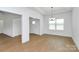 Open-concept living room boasting sleek wood-look floors and abundant natural light, creating a welcoming space at 6154 Lowder Rd, Salisbury, NC 28147