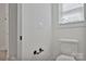 Bathroom with toilet and doorway with modern fixtures and natural light at 6160 Lowder Rd, Salisbury, NC 28147