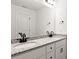Modern bathroom vanity featuring double sinks, granite countertops, and sleek black fixtures at 6160 Lowder Rd, Salisbury, NC 28147