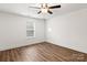 Bright bedroom with wood-look floors and ceiling fan at 6160 Lowder Rd, Salisbury, NC 28147