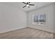 Bright, minimalist bedroom with ceiling fan and window for natural light at 6160 Lowder Rd, Salisbury, NC 28147
